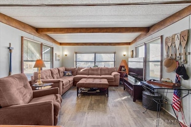 Living room open to kitchen and eating area