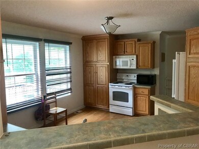 Spacious kitchen with lots of cabinets, open to th