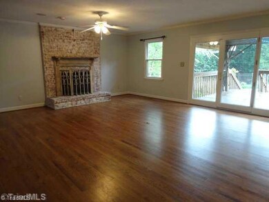 Den/Family/Great Room. Large, Open Great Room with beautiful Fireplace.  The Deck off of this room is partially covered by a Pergola and overlooks the pool.