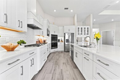 A Culinary Kitchen Is Sure to Delight. Quartz, lighting, range hood, soft touch pullouts & more!