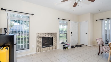 Living room features a gas log fireplace and ceili