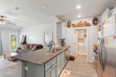 Kitchen with appliances with stainless steel finis