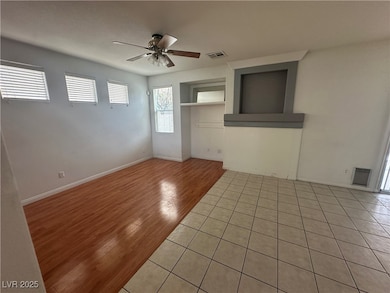 Spare room featuring ceiling fan, light wood finis
