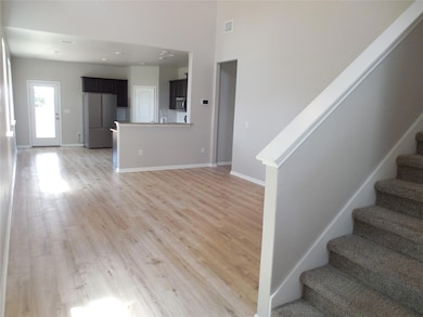 Unfurnished living room with stairs, light wood-s