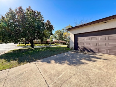 Garage with concrete driveway