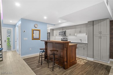 Kitchen featuring stainless steel appliances, wood