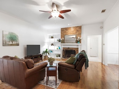 Spacious Living Area Features Brick Fireplace, She