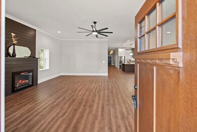 Unfurnished living room with hardwood / wood-style