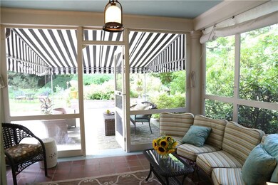 Warm days invite lounging in the sunroom with easy
