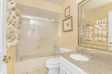 2nd Hall Bath features a Tub and Shower, vanity with granite top, new light fixture, and mirror
