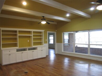 GREAT ROOM WITH BUILT-INS, DOUBLE PANE LOW E WINDOWS, HIGH CEILING-LOOKING OUT TO THE SPACIOUS COVERED BACK PATIO
