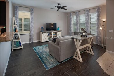 Wood look tile flooring compliments this open spac
