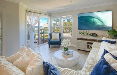 Living area opens to balcony with ocean view.