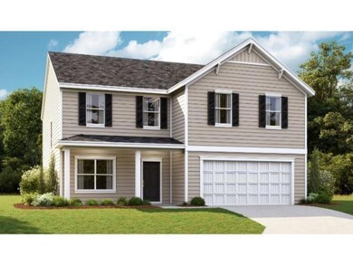 View of front of home with a garage and a front yard