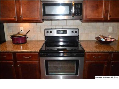 Kitchen with smooth top stove, built in microwave 