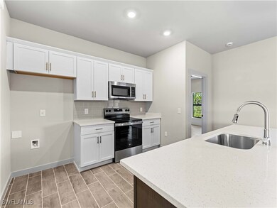 Kitchen featuring stainless steel appliances, ligh
