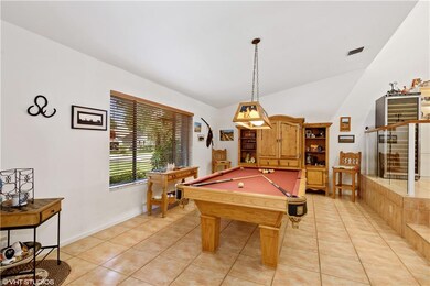 Upon entering through the double doors you have this spacious Front Room off the foyer.  Current owners are using it as a game room.