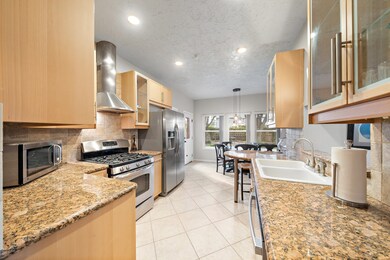 The kitchen's open layout flows into a cozy breakf
