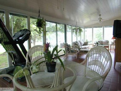 Sunroom. Tiled 350sf sunroom off of the great room and kitchen for relaxed dining and entertainment