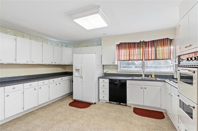 Kitchen with white cabinets.