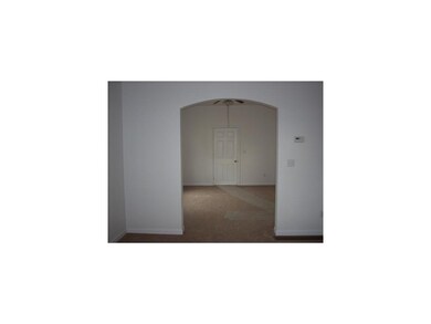 Living Room. Arched doorways from living room into
