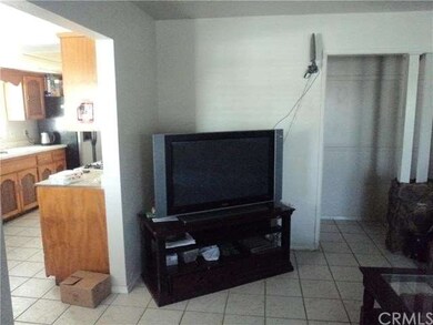 WHEN YOU WALK IN TO LIVING ROOM KITCHEN IS LOCATED