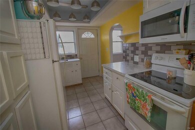 Kitchen with door to backyard.