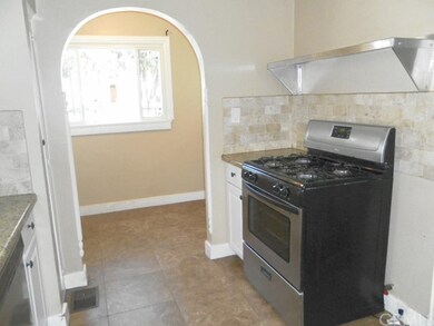 Arched doorway into added niche off of kitchen.