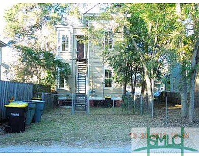 Exterior Back. BACK HAS 1ST & 2ND FLOOR EXITS & IS