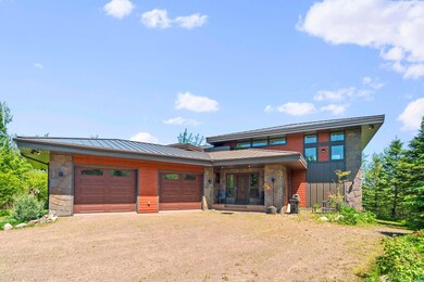 Prairie-style house featuring a garage