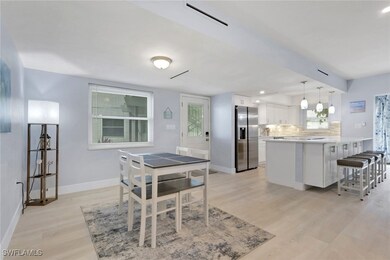 Dining space with light wood-style flooring and recessed lighting