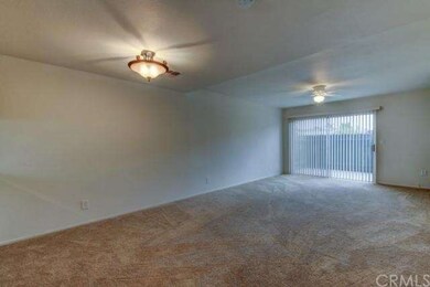 Living room with sliding glass door out to your pr