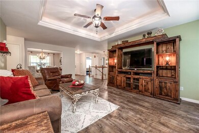 View from the living room towards the formal dining room and entry way.  Note the trey ceilings.