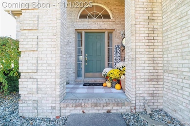 Property entrance featuring brick siding