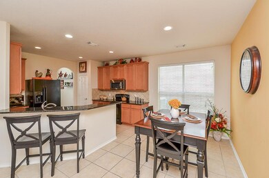 The kitchen is conveniently designed and offers access to the dining room, entry, and living area!