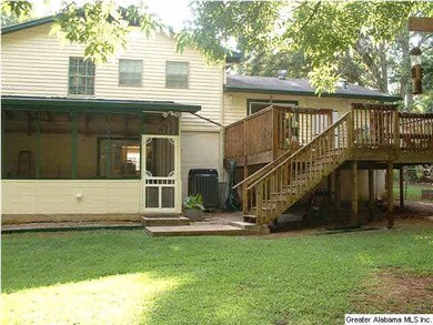 Covered screened deck off of downstairs den