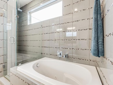 Primary Bath: Separate tub, shower and toilet.