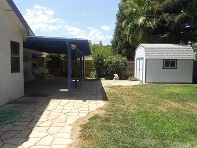 Nice back yard with stamped concrete & full covere