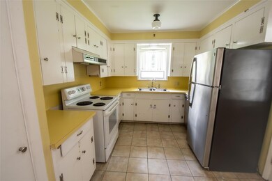 Kitchen featuring sink, stainless steel refrigerat