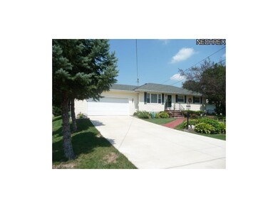 Newer concrete driveway and two car garage.