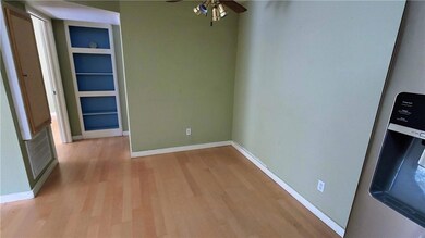 Unfurnished dining area with light wood-type floo