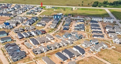 Aerial view showing the prime location of the property facing Harlem Rd.