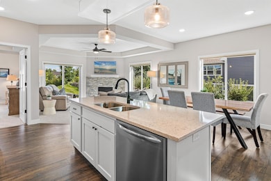 Open concept with views to the primary bedroom suite, living room, patio, and informal dining room. Desirable one-level living.