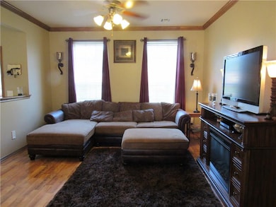 This home features a large living area with wood l