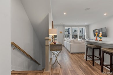 Living room featuring recessed lighting and wood f
