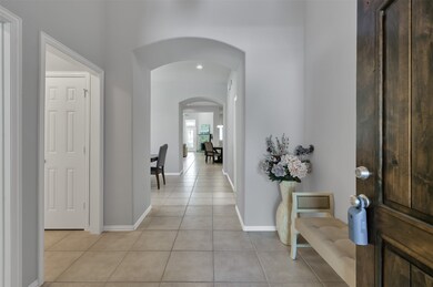 As you walk in you see a beautiful neutral color in the walls with an easy to maintain tile that flows with the Home.