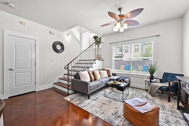 Living area with concrete flooring, ceiling fan, 