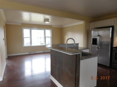 VIEW OPEN TO DINING AND KITCHEN