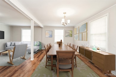 Dining room with a notable chandelier, crown moldi