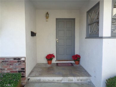 Inviting front porch and entry welcomes you into the home.